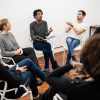 Group of multiethnic creative business people working on a project and having a brainstorming meeting. Team work and brainstorming concept.